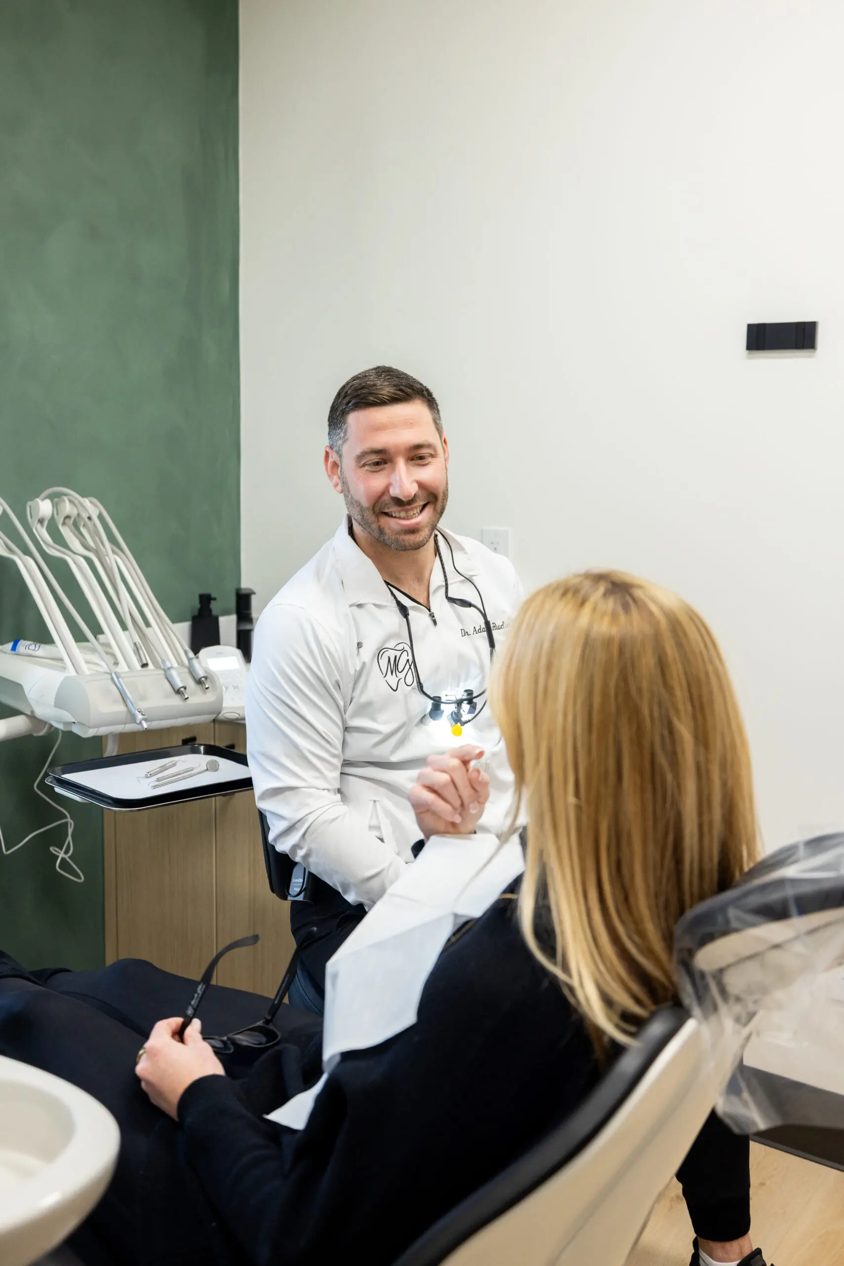 Dr. Adam Rudin is talking to a patient