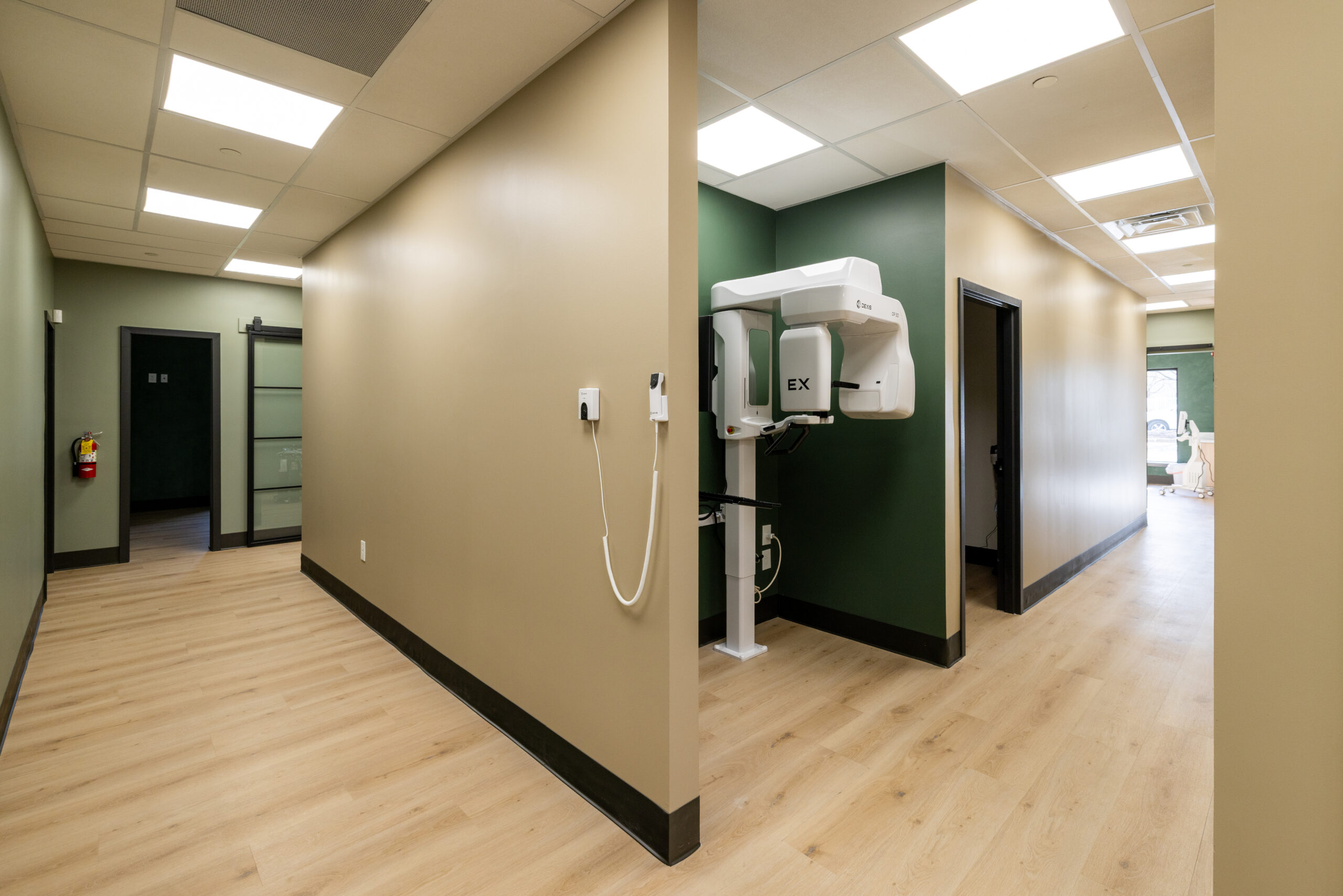 CBCT imaging machine mounted in the hallway of Maple Glen Modern Dentistry