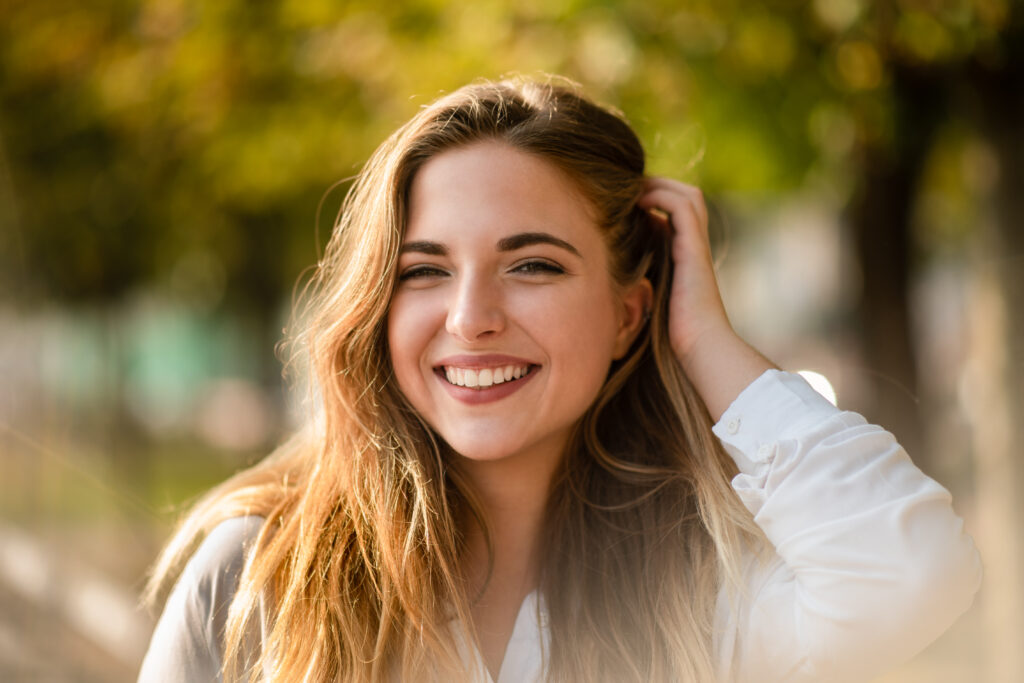 Portrait shot of teenage girl styling her hair